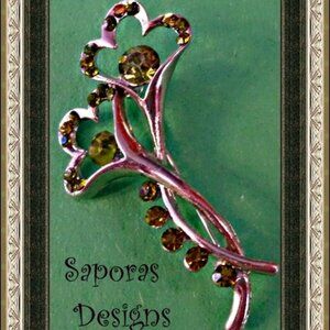Silver Tone Flower Design Brooch With Green Crystals